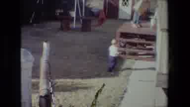 Lansing Michigan (1981): Curious Baby Takes A Fall After Squirming Out Of