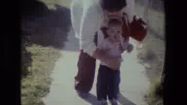 Lansing Michigan (1981): Home Video Of A Child Walking With Help From Their Parent