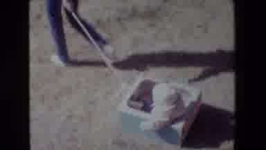 Lansing Michigan (1981): Toddler In Hat And Jacket In Blue Box Pulled Along Across
