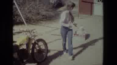 Lansing Michigan (1981): Older Girl Pulling Baby In Box Around Yard