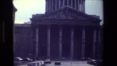 Paris France (1981): Vehicles Drive And Park In Front Of A Building With Giant