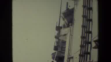 San Diego Naval Base (1981): Man Sweeps The Deck Of Ship At Sea