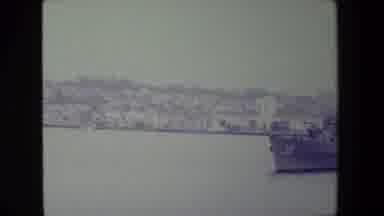 San Diego Naval Base (1981): A Large Ship Sailing Through Water