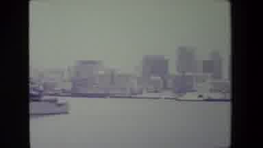 San Diego Naval Base (1981): Big Boat In Water Floating By Next To A City Of High