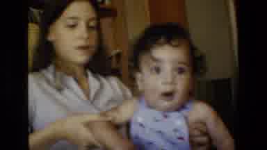 San Antonio Texas-1982: Mom Playing With The Restless Girl While Dad Sleeps