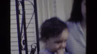 San Antonio Texas (1982): Woman Holding Playing And Bouncing Baby On Front Porch