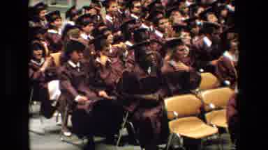 Lansing Michigan (1983): Graduates Sitting In An Audience And Clapping