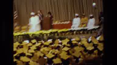 Lansing Michigan (1983): Students At A Graduation Wearing Gowns On A Stage