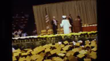 Lansing Michigan (1983): Graduation Ceremony White Caps And Gowns American Flag