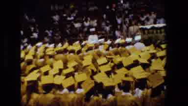 Lansing Michigan (1983): Graduates In Cap And Gowns Walking To Stage To Accept