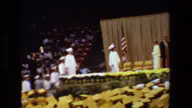 Lansing Michigan (1983): Graduate Students Wearing Cap And Gown Waiting Woman