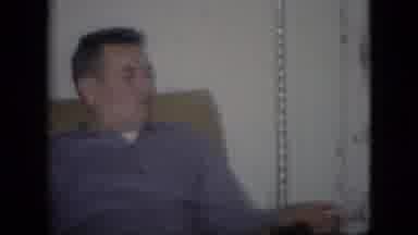 Philadelphia Pennsylvania USA (1964): Man Sitting In Chair, Pan To Christmas Tree