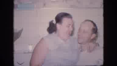 Philadelphia Pennsylvania USA (1964): Women Sitting On Male Lap Getting A Kiss