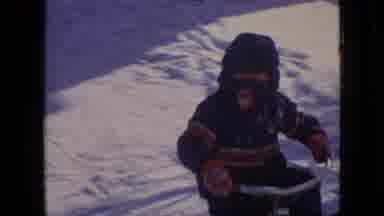 Philadelphia Pennsylvania USA (1964): A Boy Plays In The Snow And Then Goes To