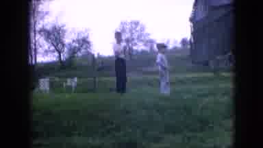 Philadelphia Pennsylvania USA (1964): Two Boys Watch A Man On A Riding Lawnmower