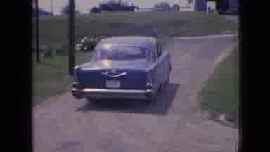 Philadelphia Pennsylvania USA (1964): A Blue Old Car Turning Right Before It Sped