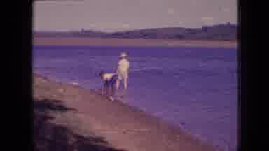Philadelphia Pennsylvania USA (1964): A Woman Supervises Two Boys Fishing Along