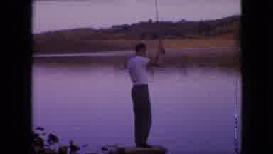 Philadelphia Pennsylvania USA (1964): Man And His Son Fishing On A Lake Reels In