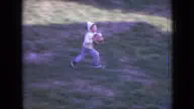 Philadelphia Pennsylvania USA (1964): Child Running Back And Forth Outside In A