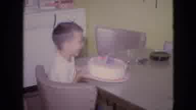 Philadelphia Pennsylvania USA (1964): Child Blows Out Candles On His Birthday Cake
