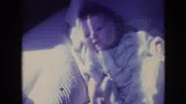 Philadelphia Pennsylvania USA (1964): Baby Laying On It's Back In White