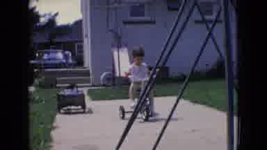 New Jersey USA (1965): A Little Girls Rides Her Tricycle In The Backyard, Then