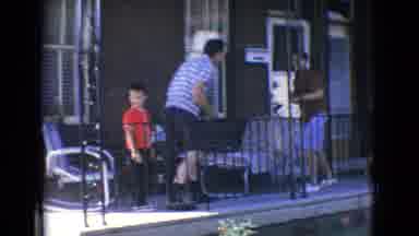 New Jersey USA (1965): Man Playing With And Play-Smacking Boy
