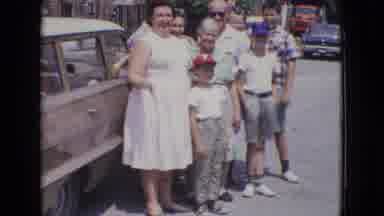 New Jersey USA (1965): Family Posing Together In Street By Car Man Smiling