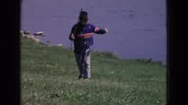 New Jersey USA (1965): Young Boy Walking Near A Pond Carrying A Fishing Pole