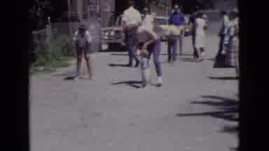 New Jersey USA (1965): Mother Puts Child To Walk Under Her Legs
