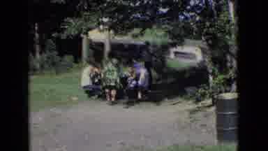 New Jersey USA (1965): A Family Sitting Down At A Park And Having A Picnic On A