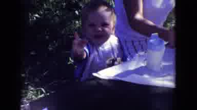 New Jersey USA (1965): Baby Waving To Camera At A Family Picnic