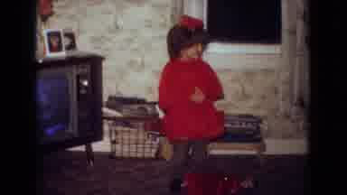 New Jersey USA (1965): Young Girl In A Red Outfit Waving To The Camera