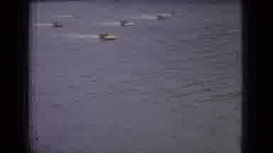 New Jersey USA (1965): Group Of Speed-Boaters Racing Down A River