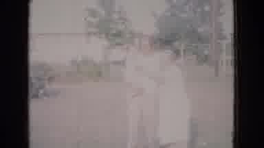 New Jersey USA (1965): Family Standing Outside With Baby Waving