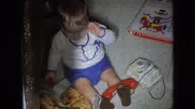 Athens Ohio USA (1966): Kid Plays With Toys On The Living Room Floor