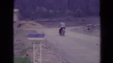 Athens Ohio USA (1966): Man Driving A Motorcycle On A Dusty Road