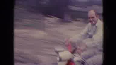 Athens Ohio USA (1966): Man Rides Vintage Moped Down The Road In The Countryside