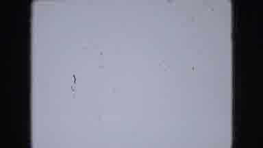 Athens Ohio USA (1966): Baby Lying On The Floor Next To A White Blanket Raising
