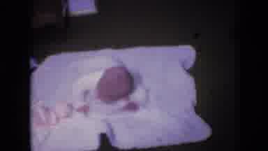 Athens Ohio USA-1966: Infant Lifting Head On Blanket
