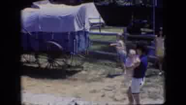 Athens Ohio USA (1966): Woman With Baby Near Covered Wagon And Children Walking In