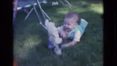 Athens Ohio USA (1966): Human Baby Laying Down Crawling On Grass Playing With Toy