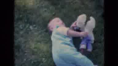 Athens Ohio USA-1966: Baby Playing With Stuffed Toy On Grass