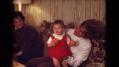 Athens Ohio USA (1966): A Woman Holding A Baby On A Couch As Another Woman Beside