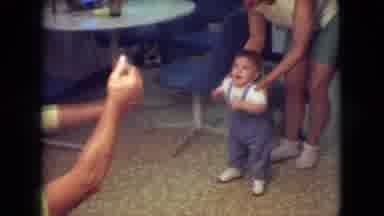 Athens Ohio USA (1966): Small Boy In Overalls Enticed To Walk Towards Someone