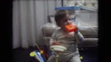 Athens Ohio USA (1966): Baby Standing With Toy