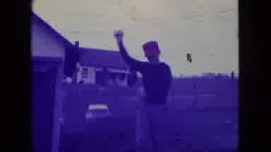 New Jersey USA (1966): Woman Standing Outside In Jacket Men Walking