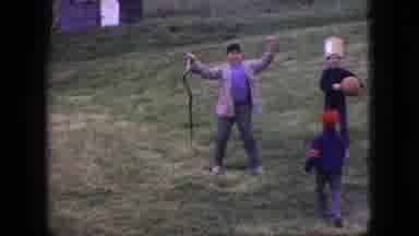 New Jersey USA (1966): Boys Play On A Slope While It Is Mowed And One Young Man