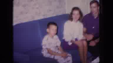 New Jersey USA (1966): A Couple And Boy Sit On A Couch And The Woman Pats The Boy