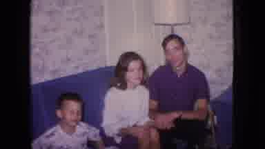 New Jersey USA (1966): Young Couple Sitting On Blue Couch With Child Posing